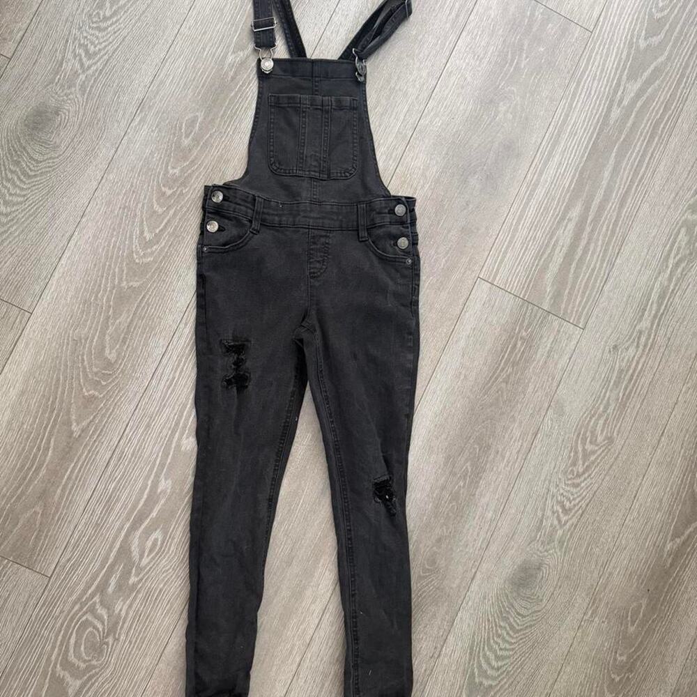 Black denim overalls with distressed